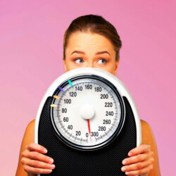 Beautiful young s woman holding scales Beautiful young s woman holding scales